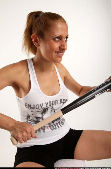 Woman Adult Athletic White Sitting poses Casual Fighting with bat