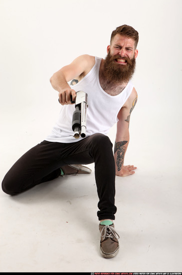 Man Adult Athletic White Kneeling poses Casual Fighting with shotgun