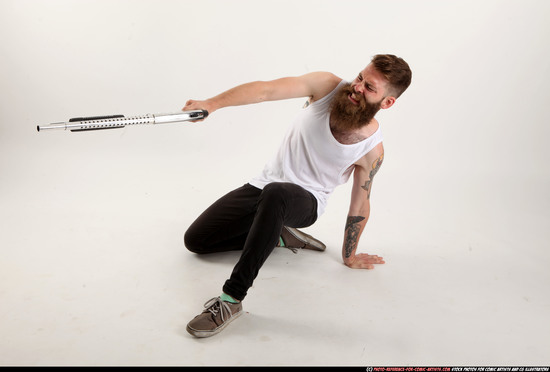 Man Adult Athletic White Kneeling poses Casual Fighting with shotgun