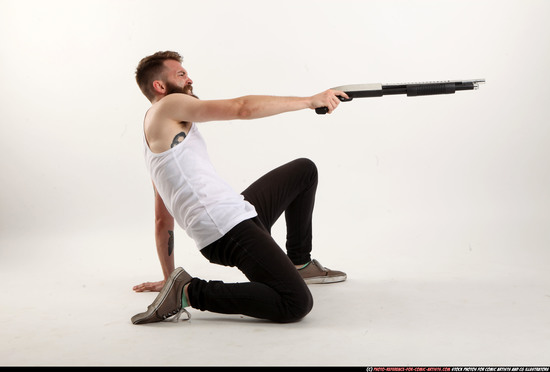 Man Adult Athletic White Kneeling poses Casual Fighting with shotgun