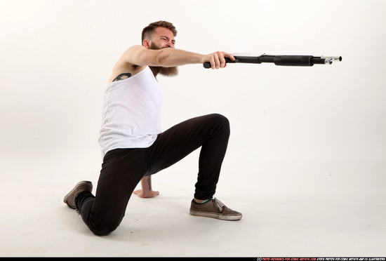 Man Adult Athletic White Kneeling poses Casual Fighting with shotgun