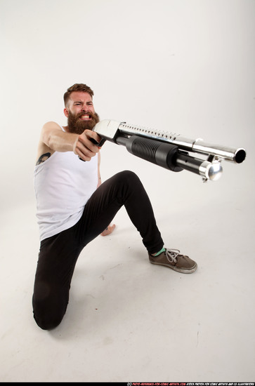 Man Adult Athletic White Kneeling poses Casual Fighting with shotgun