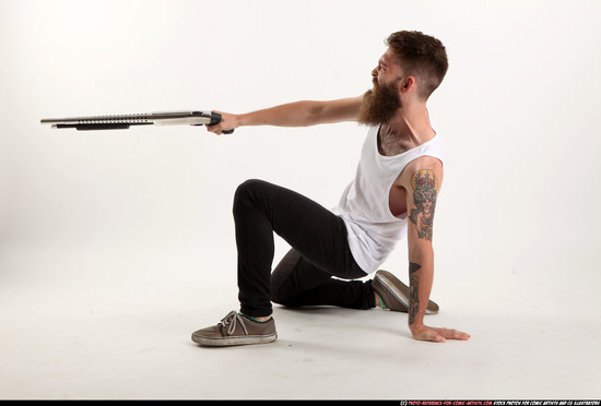 Man Adult Athletic White Kneeling poses Casual Fighting with shotgun