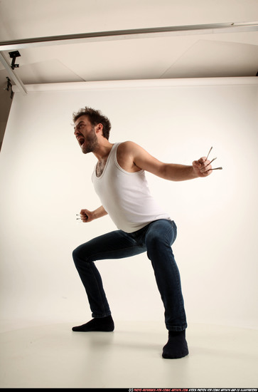 Man Adult Average White Fist fight Kneeling poses Casual