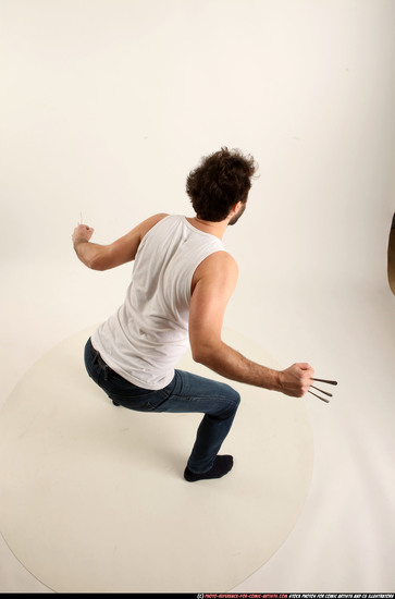 Man Adult Average White Fist fight Kneeling poses Casual