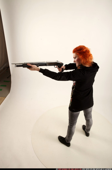 Woman Adult Athletic White Standing poses Casual Fighting with shotgun