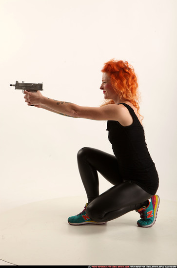 Woman Adult Athletic White Fighting with submachine gun Kneeling poses Casual