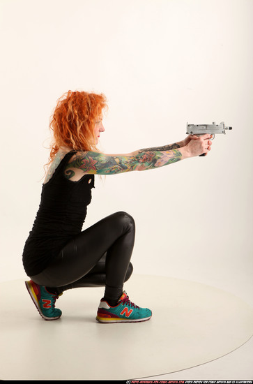 Woman Adult Athletic White Fighting with submachine gun Kneeling poses Casual