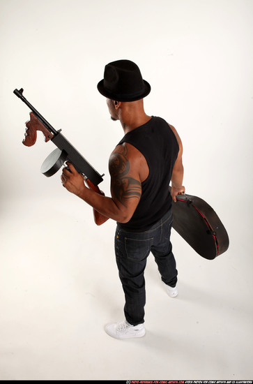 Man Adult Athletic Black Fighting with submachine gun Standing poses Casual