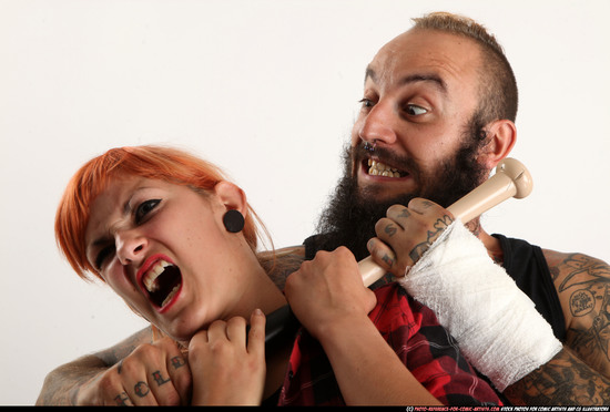 Man & Woman Adult Athletic White Standing poses Casual Fighting with bat