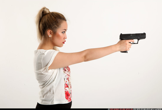 Woman Young Average Fighting with gun Standing poses Casual Asian