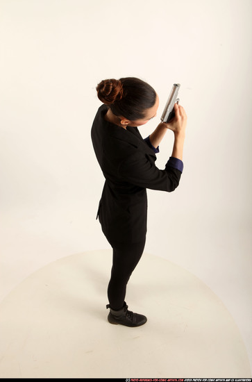 Woman Young Athletic White Fighting with gun Standing poses Business