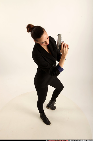 Woman Young Athletic White Fighting with gun Standing poses Business