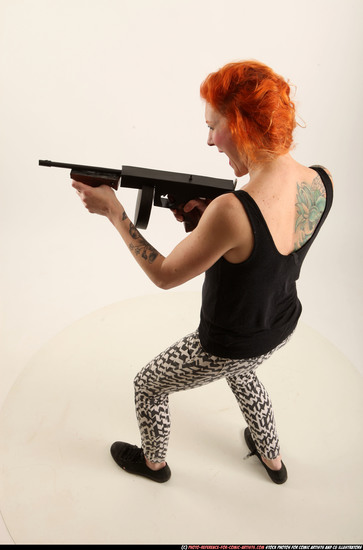 Woman Adult Athletic White Fighting with submachine gun Standing poses Casual