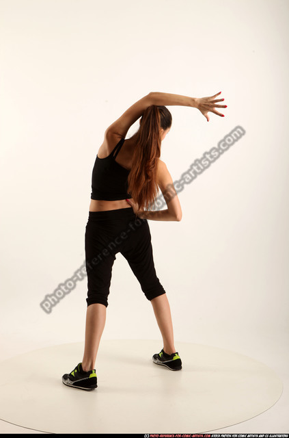 Young modern flexible hip-hop dance girl standing on one leg. Stock Photo  by ©studiomediaceh 56432327