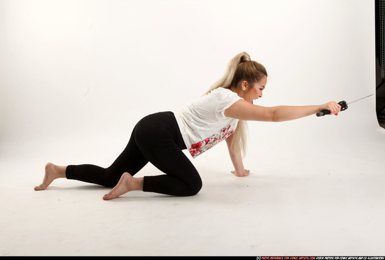 Woman Young Average Fighting with sword Kneeling poses Casual Asian