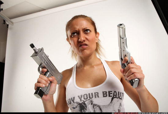 Woman Adult Athletic White Fighting with gun Kneeling poses Casual