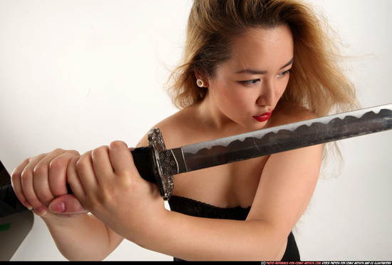 Woman Young Average Fighting with sword Standing poses Casual Asian