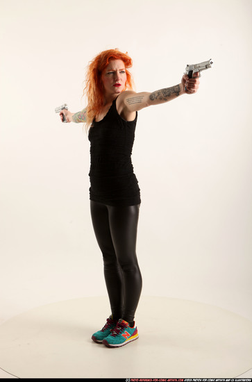 Woman Adult Athletic White Fighting with gun Standing poses Casual