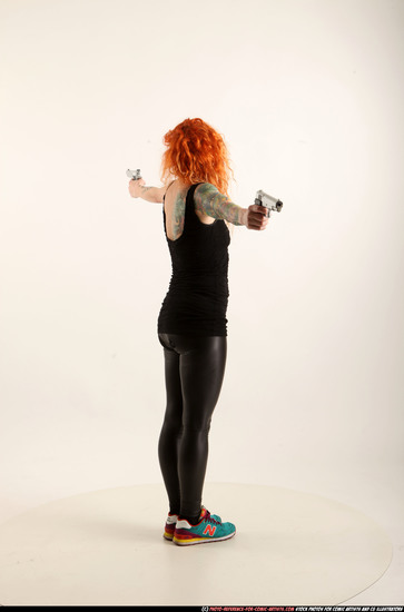 Woman Adult Athletic White Fighting with gun Standing poses Casual