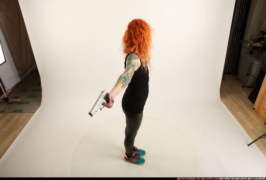 Woman Adult Athletic White Fighting with gun Standing poses Casual