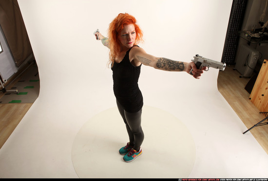 Woman Adult Athletic White Fighting with gun Standing poses Casual