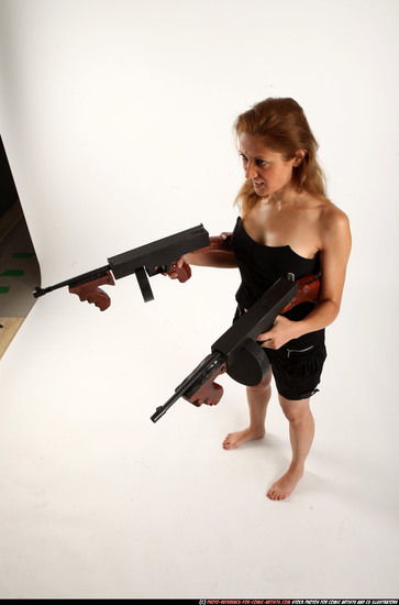 Woman Adult Athletic White Fighting with submachine gun Standing poses Casual