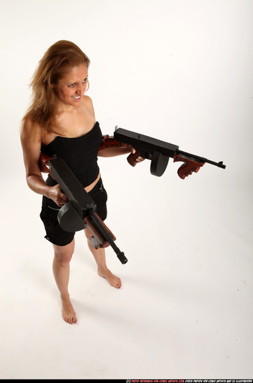 Woman Adult Athletic White Fighting with submachine gun Standing poses Casual