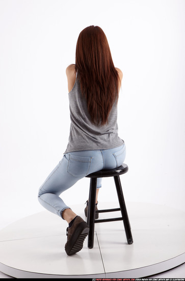 Woman Adult Athletic White Fighting with gun Sitting poses Casual