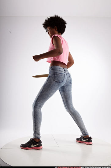 Woman Adult Athletic Black Fighting with sword Standing poses Casual