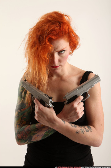 Woman Adult Athletic White Fighting with gun Standing poses Casual