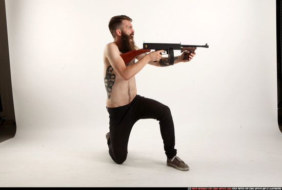 Man Adult Athletic White Fighting with submachine gun Kneeling poses Pants