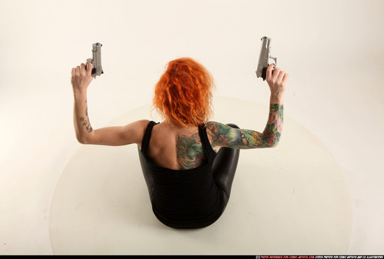 Woman Adult Athletic White Fighting with gun Sitting poses Casual