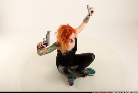 Woman Adult Athletic White Fighting with gun Sitting poses Casual