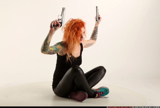 Woman Adult Athletic White Fighting with gun Sitting poses Casual