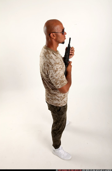 Man Adult Athletic Black Fighting with submachine gun Standing poses Army