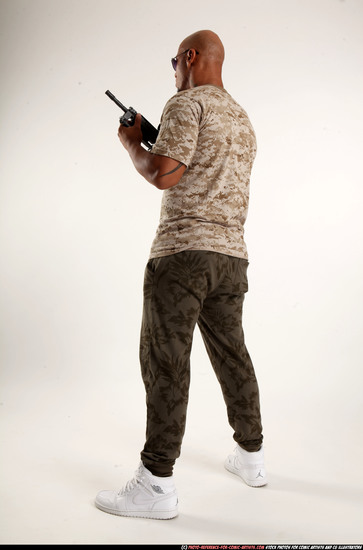 Man Adult Athletic Black Fighting with submachine gun Standing poses Army