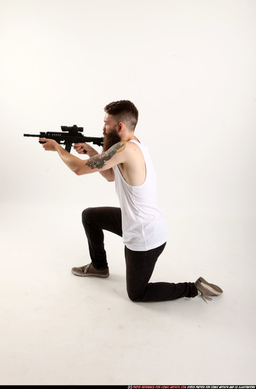 Man Adult Athletic White Fighting with submachine gun Kneeling poses Casual