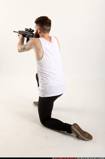 Man Adult Athletic White Fighting with submachine gun Kneeling poses Casual