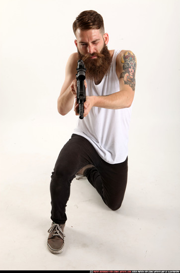 Man Adult Athletic White Fighting with submachine gun Kneeling poses Casual