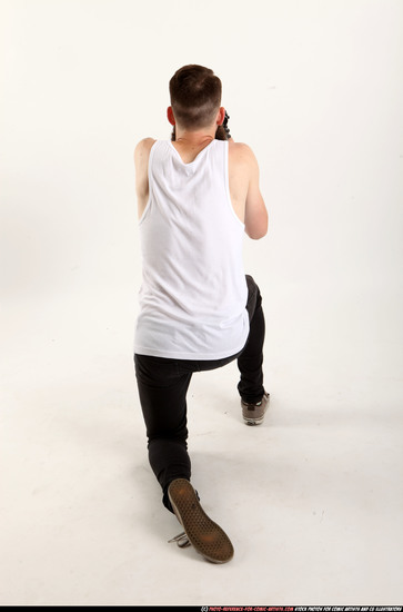 Man Adult Athletic White Fighting with submachine gun Kneeling poses Casual