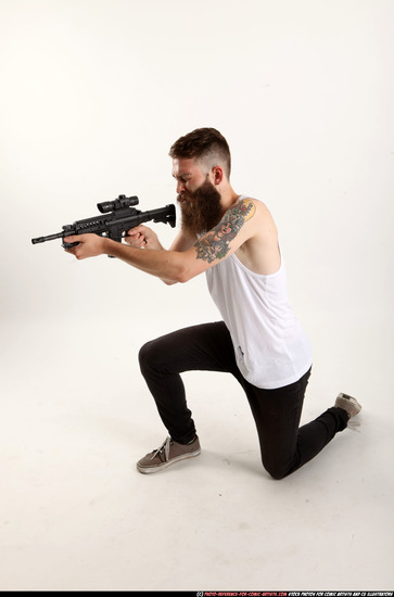 Man Adult Athletic White Fighting with submachine gun Kneeling poses Casual