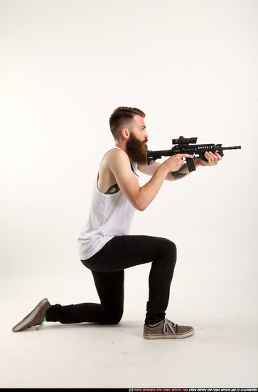 Man Adult Athletic White Fighting with submachine gun Kneeling poses Casual