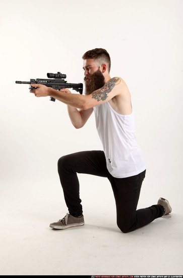 Man Adult Athletic White Fighting with submachine gun Kneeling poses Casual