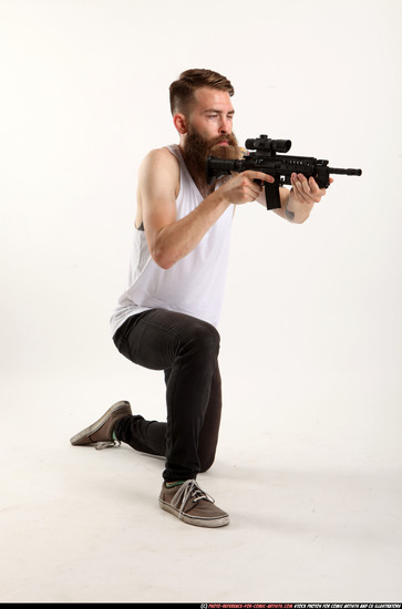 Man Adult Athletic White Fighting with submachine gun Kneeling poses Casual