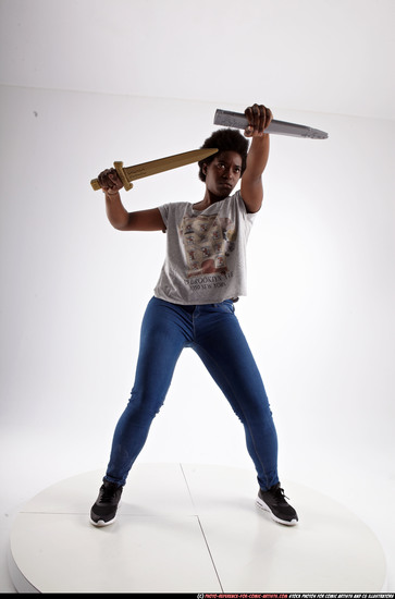 Woman Adult Athletic Black Fighting with sword Standing poses Casual