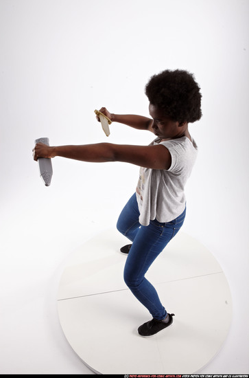 Woman Adult Athletic Black Fighting with sword Standing poses Casual