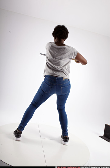 Woman Adult Athletic Black Fighting with sword Standing poses Casual