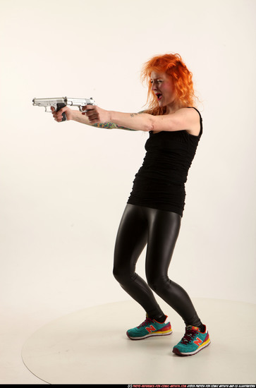 Woman Adult Athletic White Fighting with gun Standing poses Casual