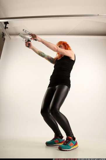 Woman Adult Athletic White Fighting with gun Standing poses Casual